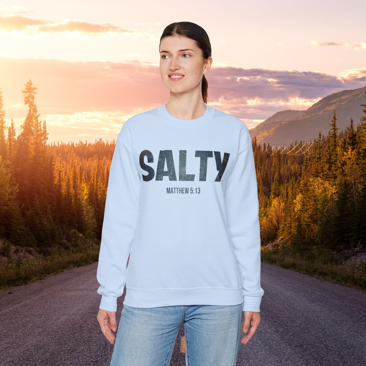 Stay SALTY Matthew 5:13 Unisex Sweatshirt S to 5XL by Faithful Living Home Front View on a Woman in Light Blue Color