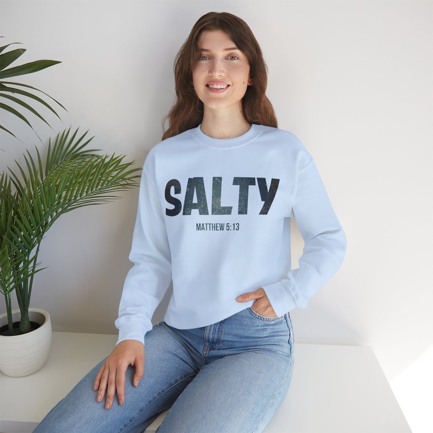 Stay SALTY Matthew 5:13 Unisex Sweatshirt S to 5XL by Faithful Living Home Front View in Light Blue Color Lifestyle photo