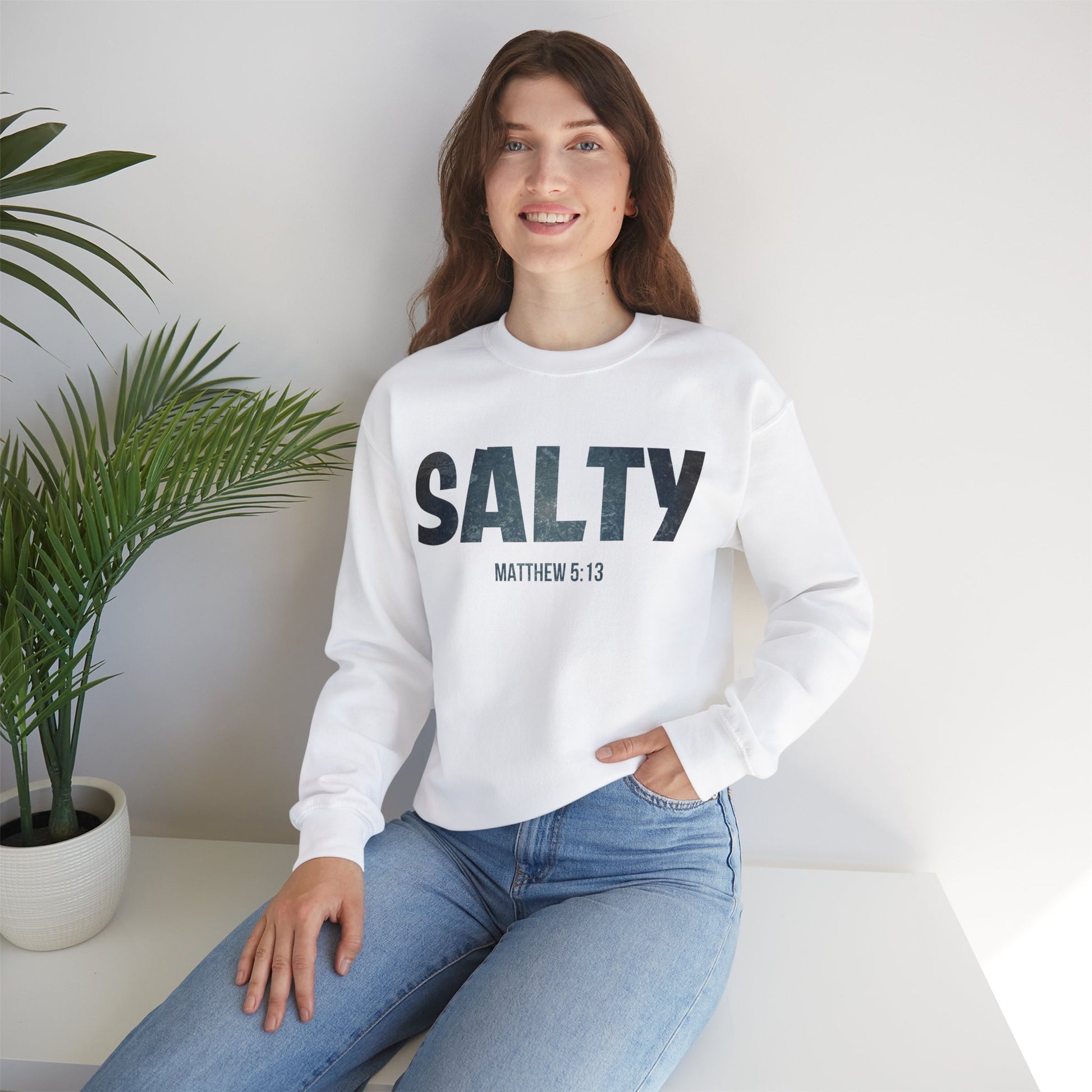 Stay SALTY Matthew 5:13 Unisex Sweatshirt S to 5XL by Faithful Living Home Front View worn by a woman in White Color